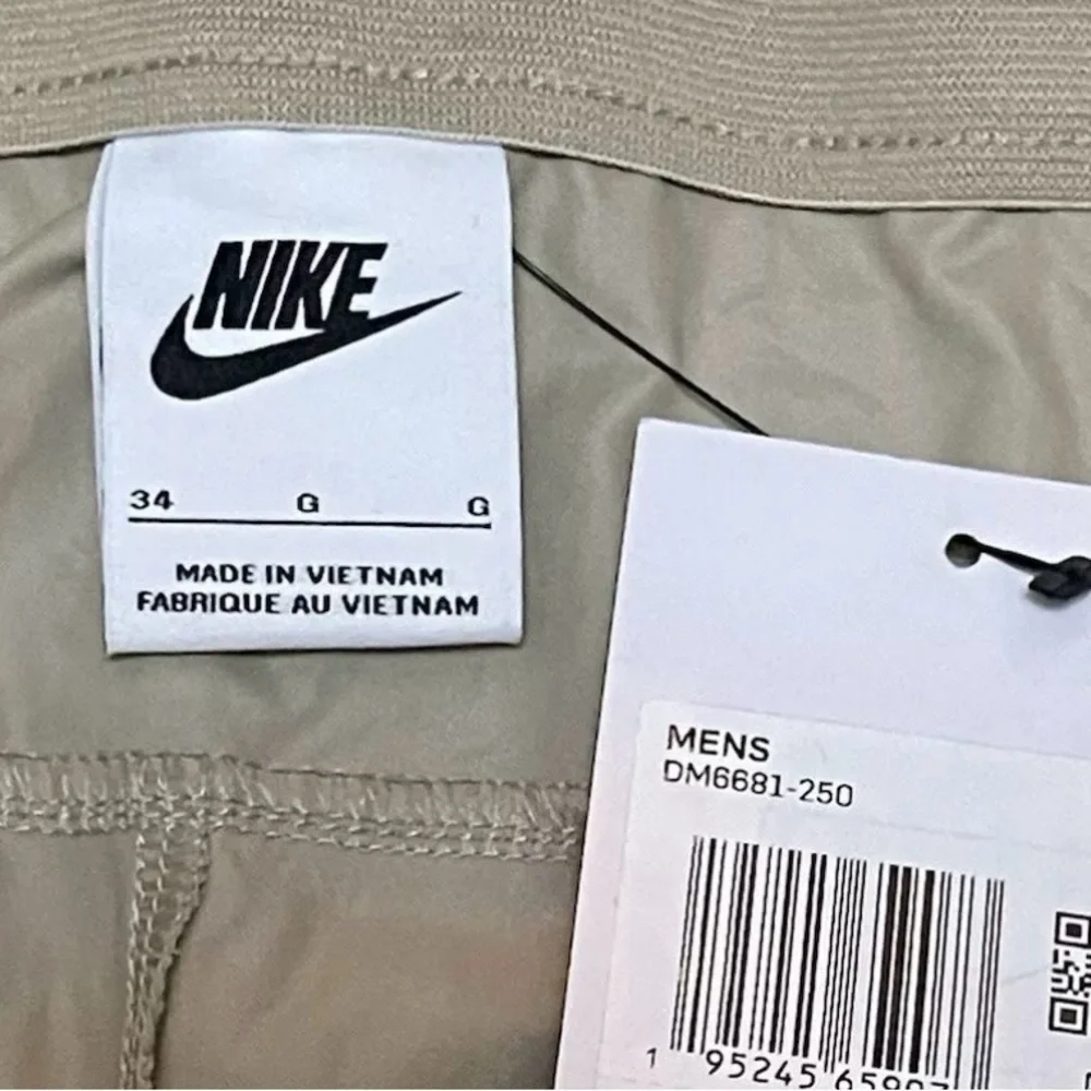 NEW Nike Pants Standard Fit Tapered Leg Men's Size 34 Tan Khaki Golf Pockets